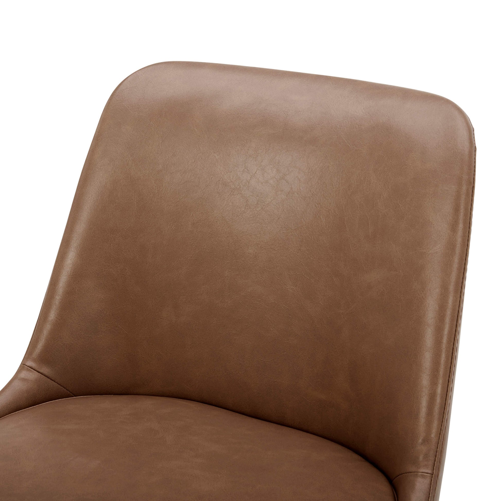 Close-up of Rhett Dining Chair's brown faux leather seat and backrest - CHITA Living