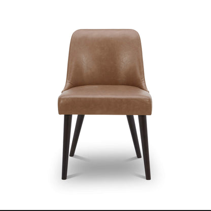 Front view of Rhett Dining Chair in brown faux leather with tapered wooden legs - CHITA Living