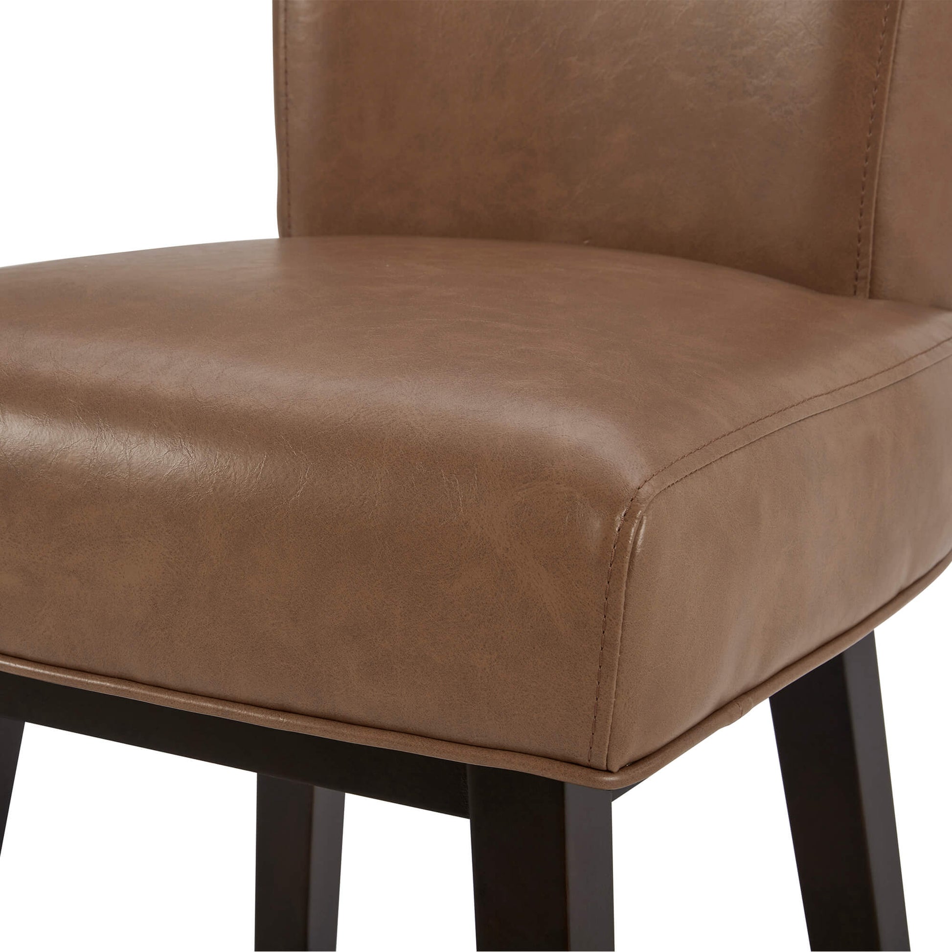 Close-up of Alina swivel stool in brown faux leather, showcasing its comfy seating - CHITA Living