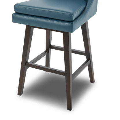 Close-up of Lissa Swivel Bar Stool with blue leather seat and dark wooden legs - CHITA Living