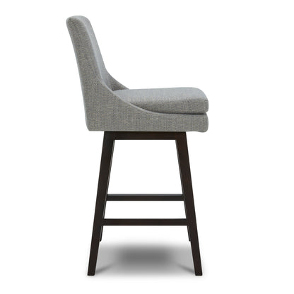 Lissa Swivel Bar & Counter Stool in grey fabric with sturdy wooden frame, side view - CHITA Living