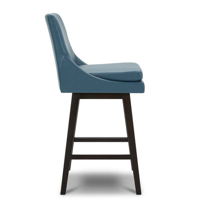 Side view of Lissa Swivel Bar Stool with blue leather seat and sturdy black legs - CHITA Living
