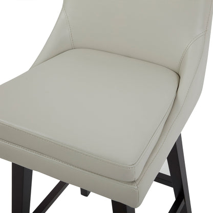 Close-up of Lissa Swivel Bar Stool with light grey leather seat and black wooden legs - CHITA Living