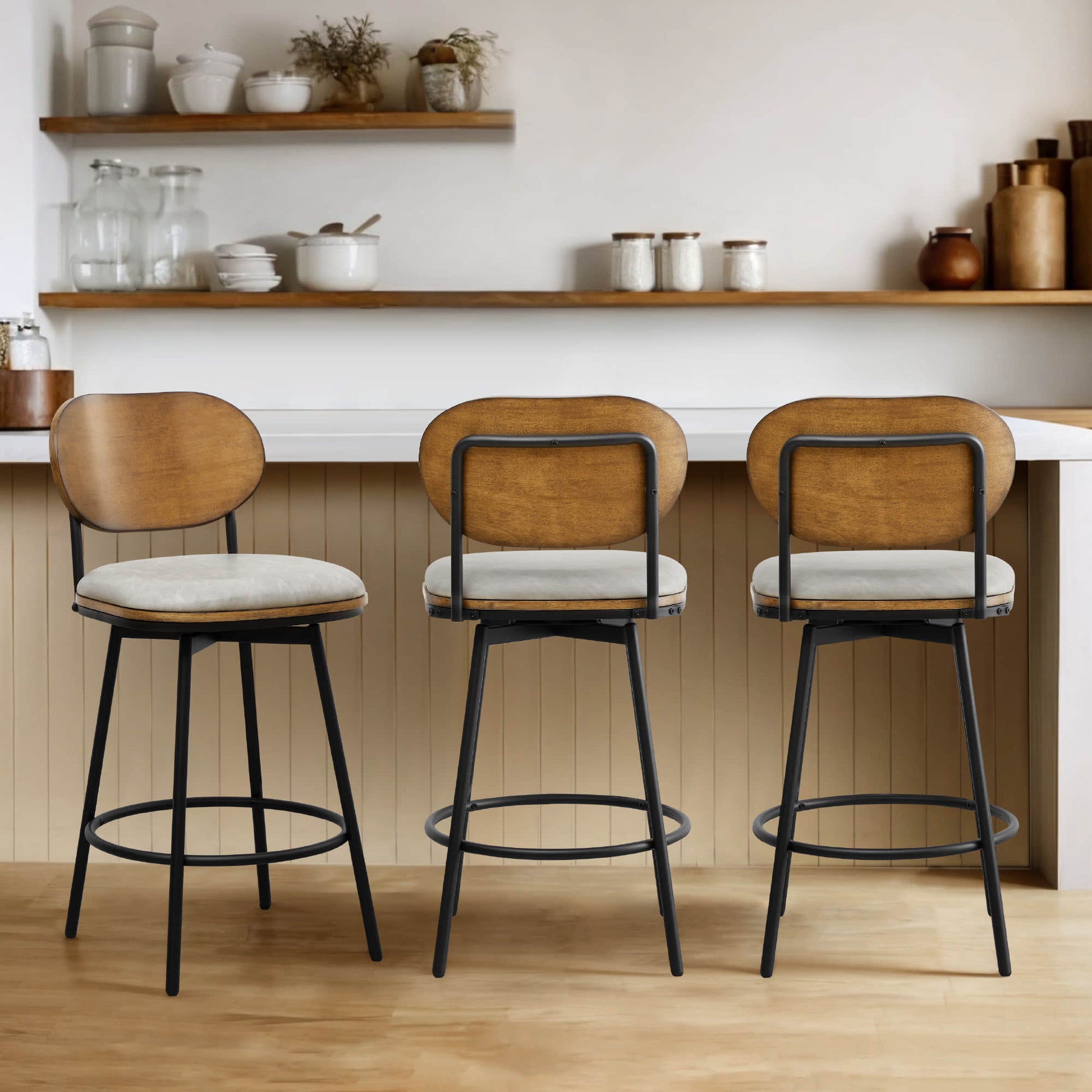 Set of three Aislinn swivel bar stools with cream cushions and wooden backs in modern kitchen - CHITA Living