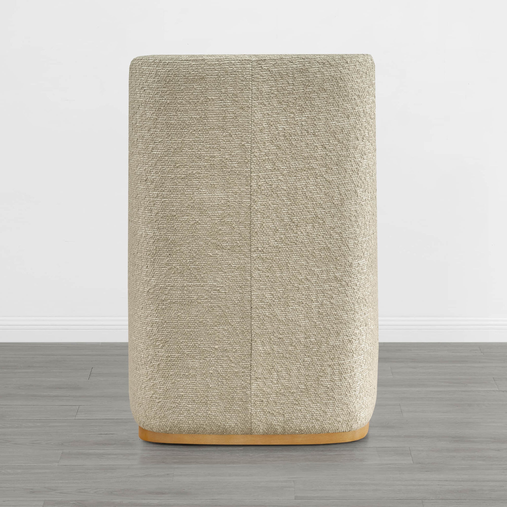 Beige textured wingback dining chair with a curved wooden base in minimalist decor - CHITA Living