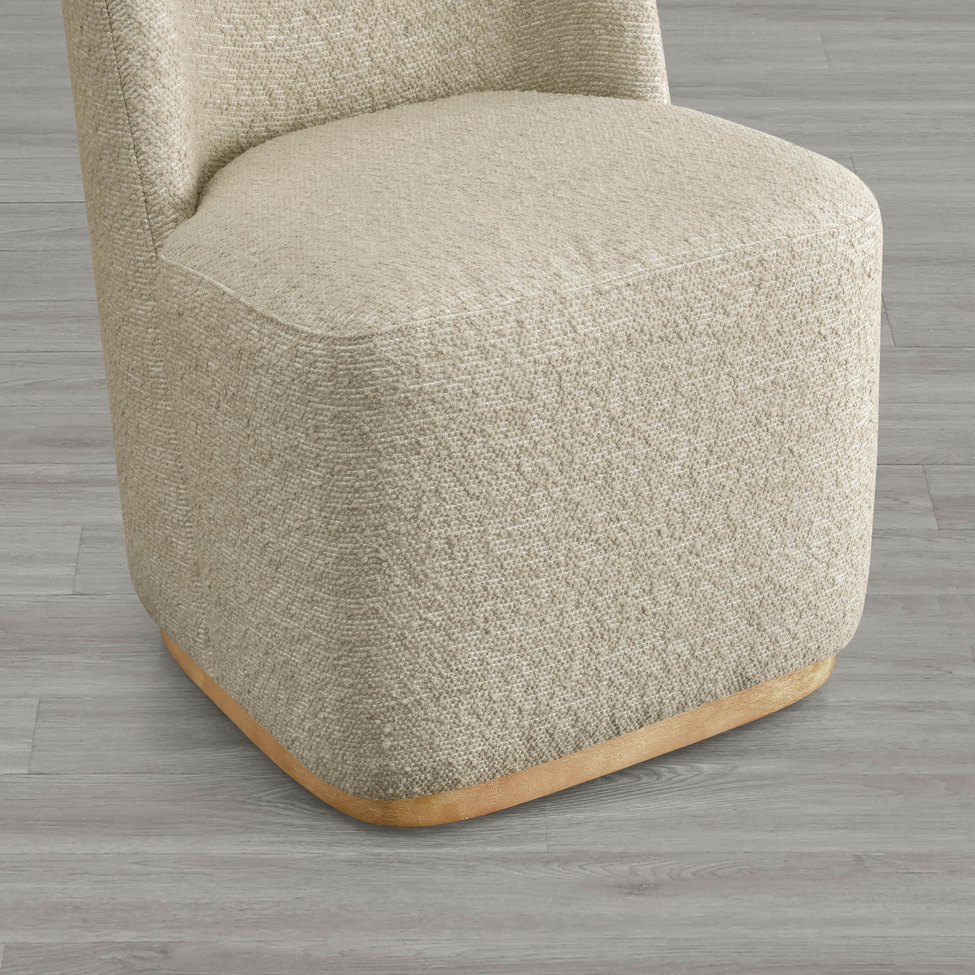 Beige textured wingback chair with curved wooden base in modern interior - CHITA Living