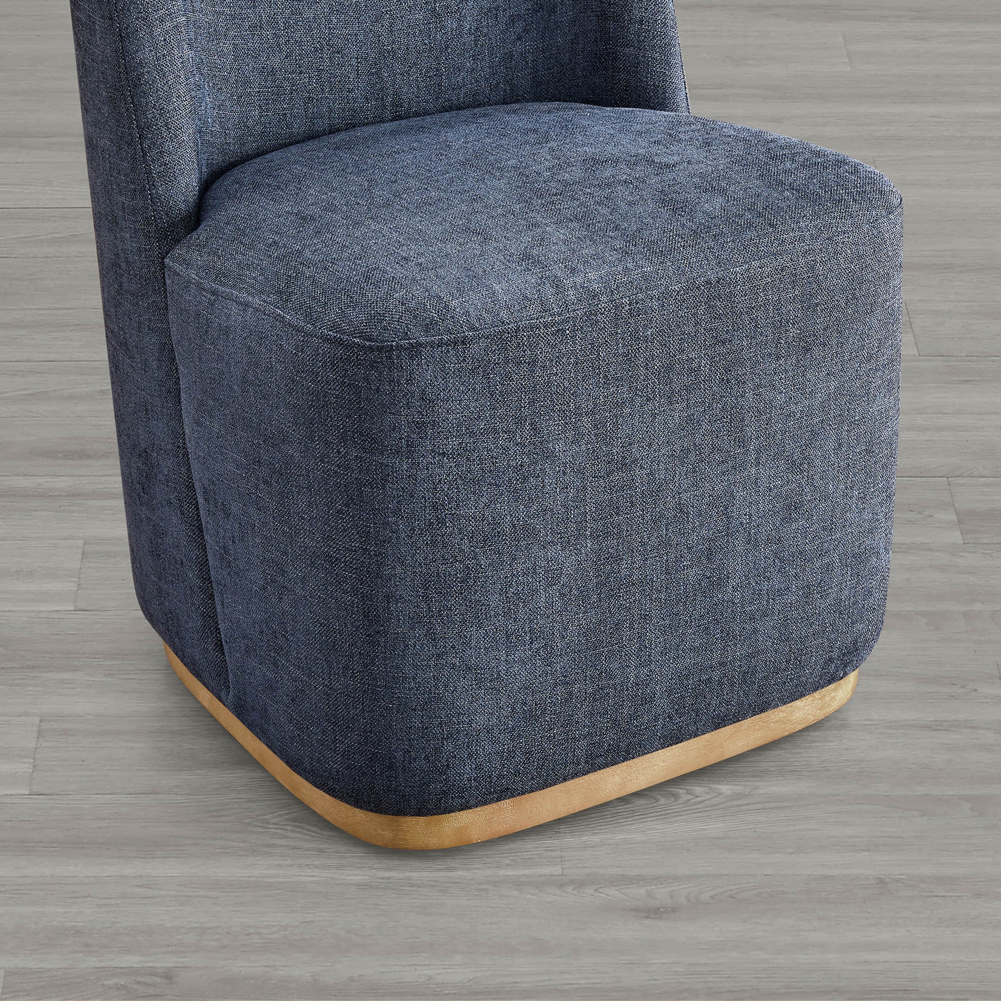 Blue textured dining chair base with curved wood accent in modern setting - CHITA Living