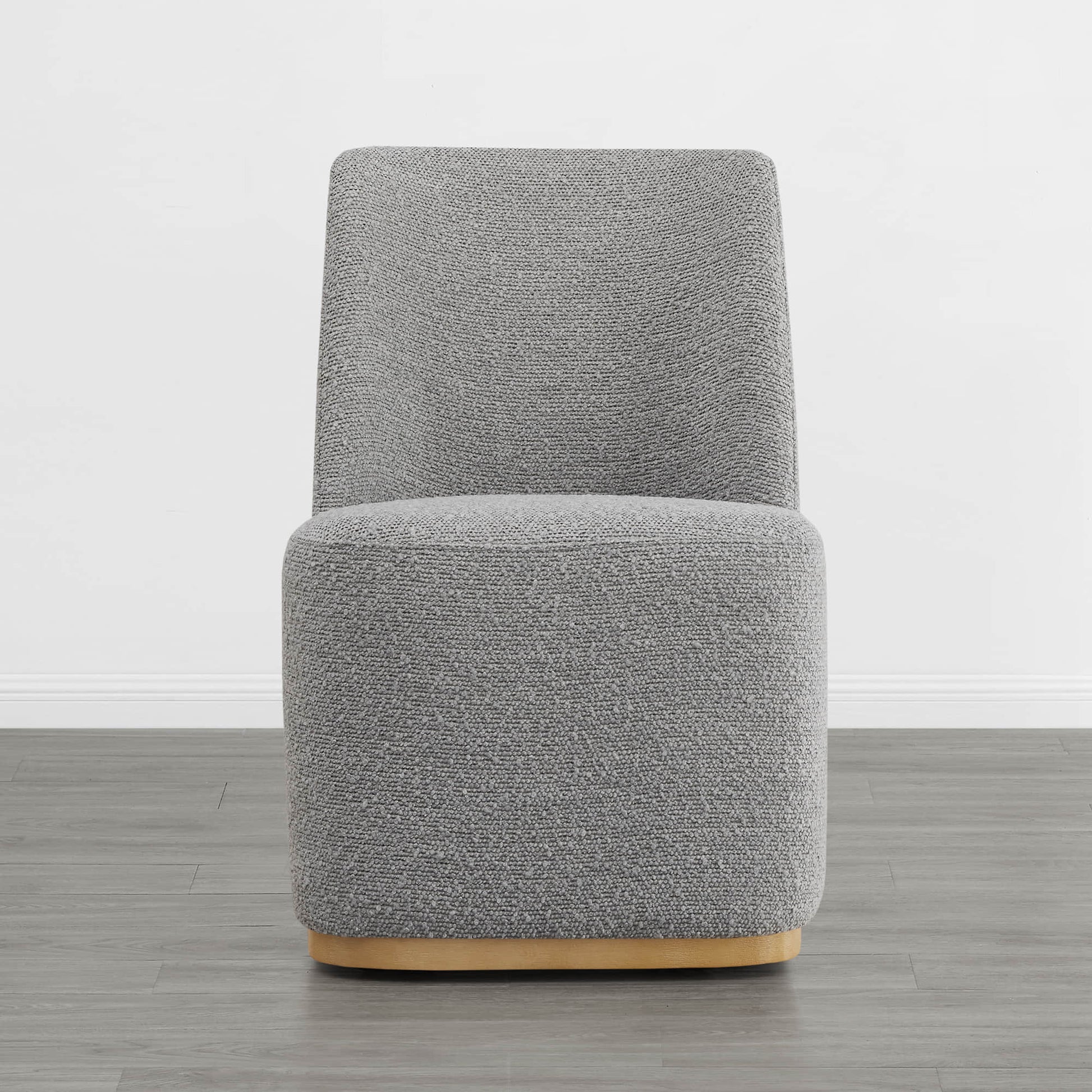 Contemporary gray upholstered dining chair with curved wooden base in minimalist setting - CHITA Living