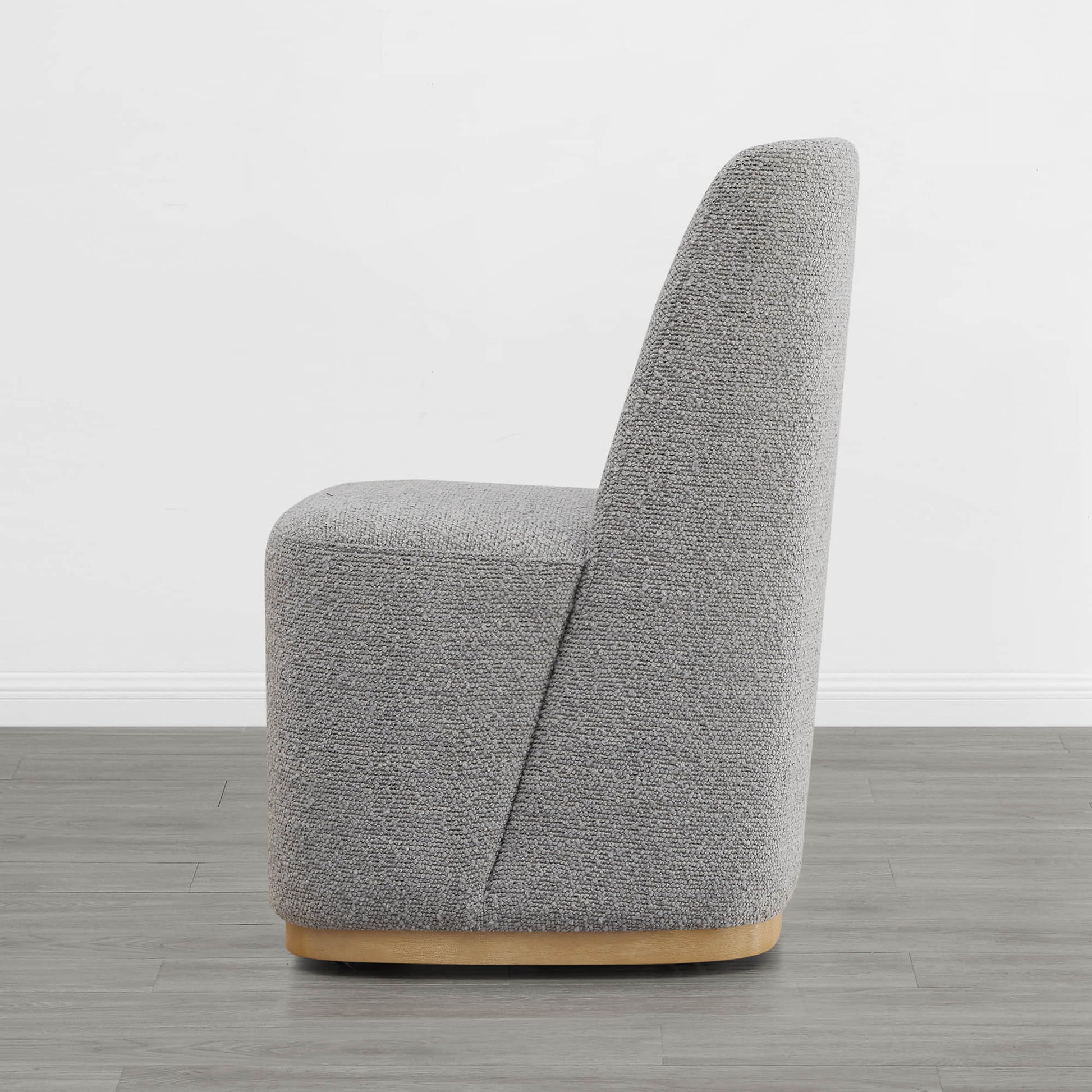 Side view of gray textured dining chair with wooden base in modern room - CHITA Living