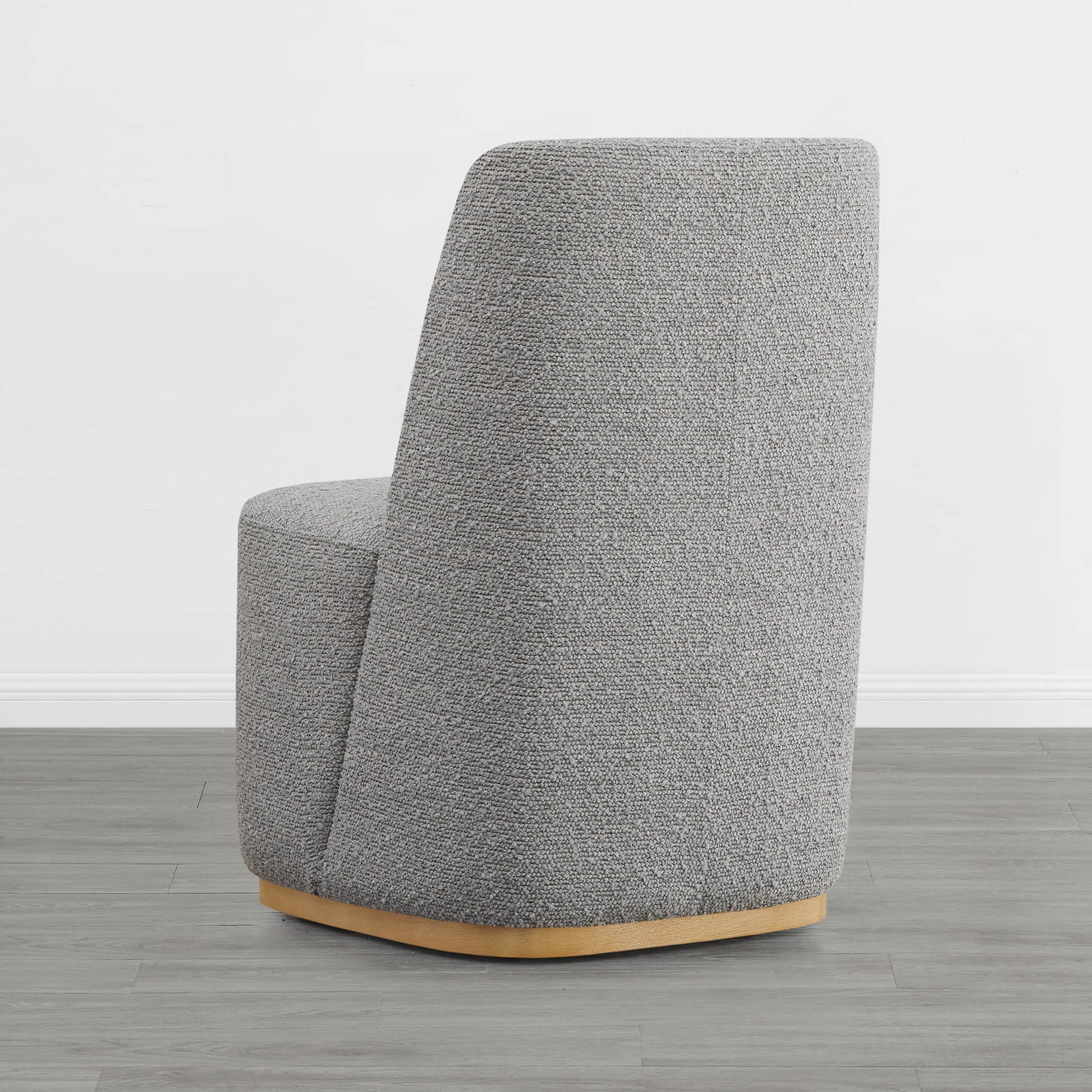 Curved gray wingback dining chair with wooden base in minimalist room - CHITA Living