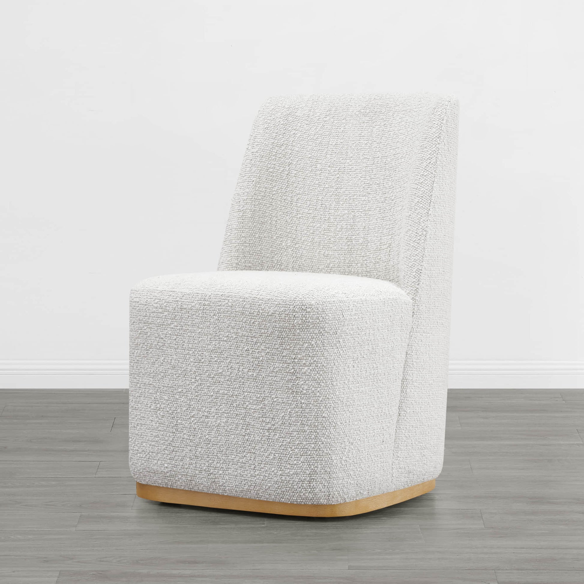 Cream textured wingback dining chair with curved base in minimalist room - CHITA Living