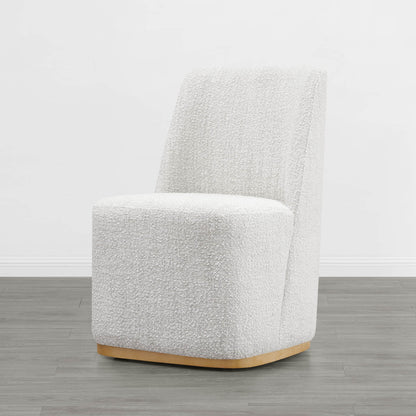 Cream textured wingback dining chair with curved base in minimalist room - CHITA Living