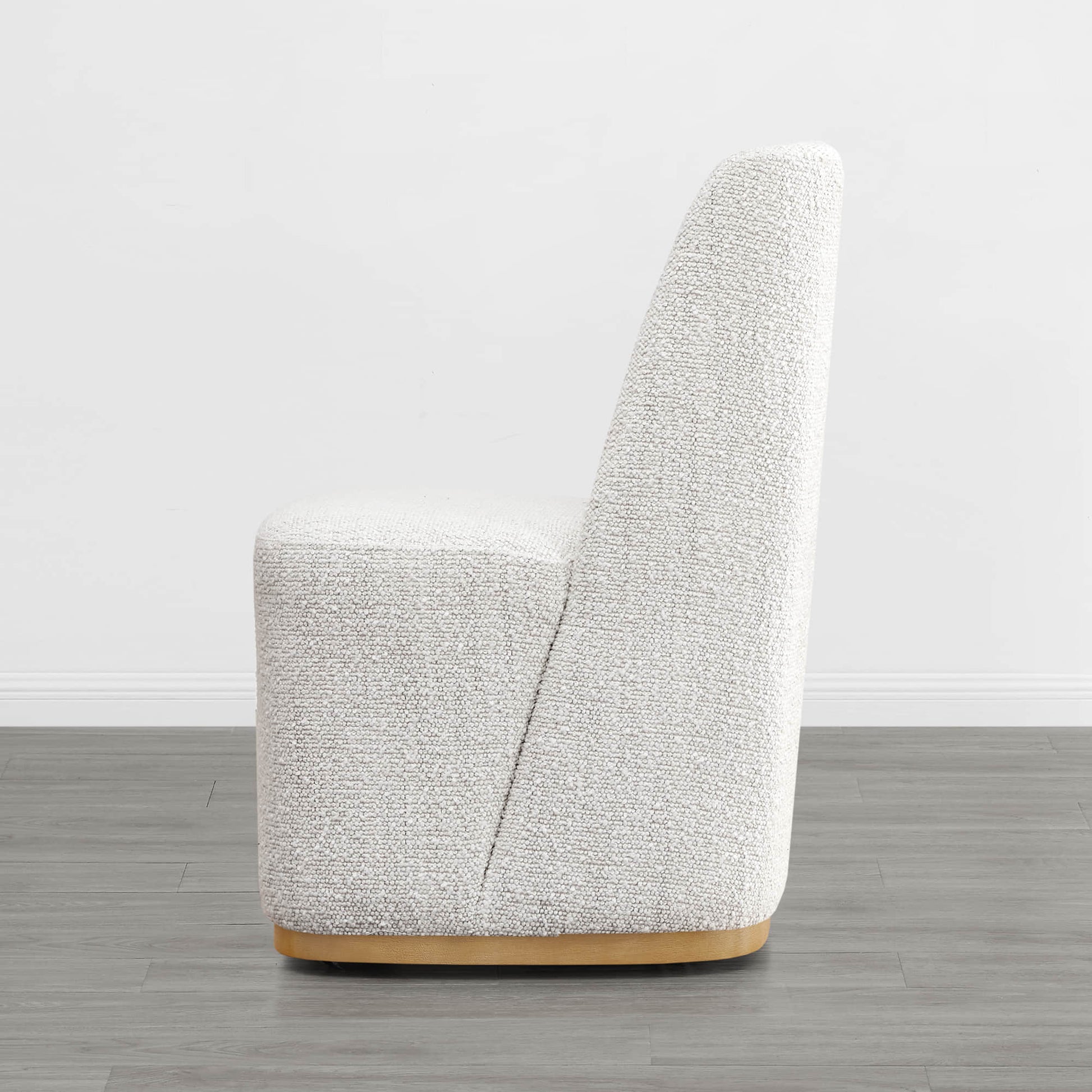 Beige wingback chair with curved design and wooden base in modern interior - CHITA Living