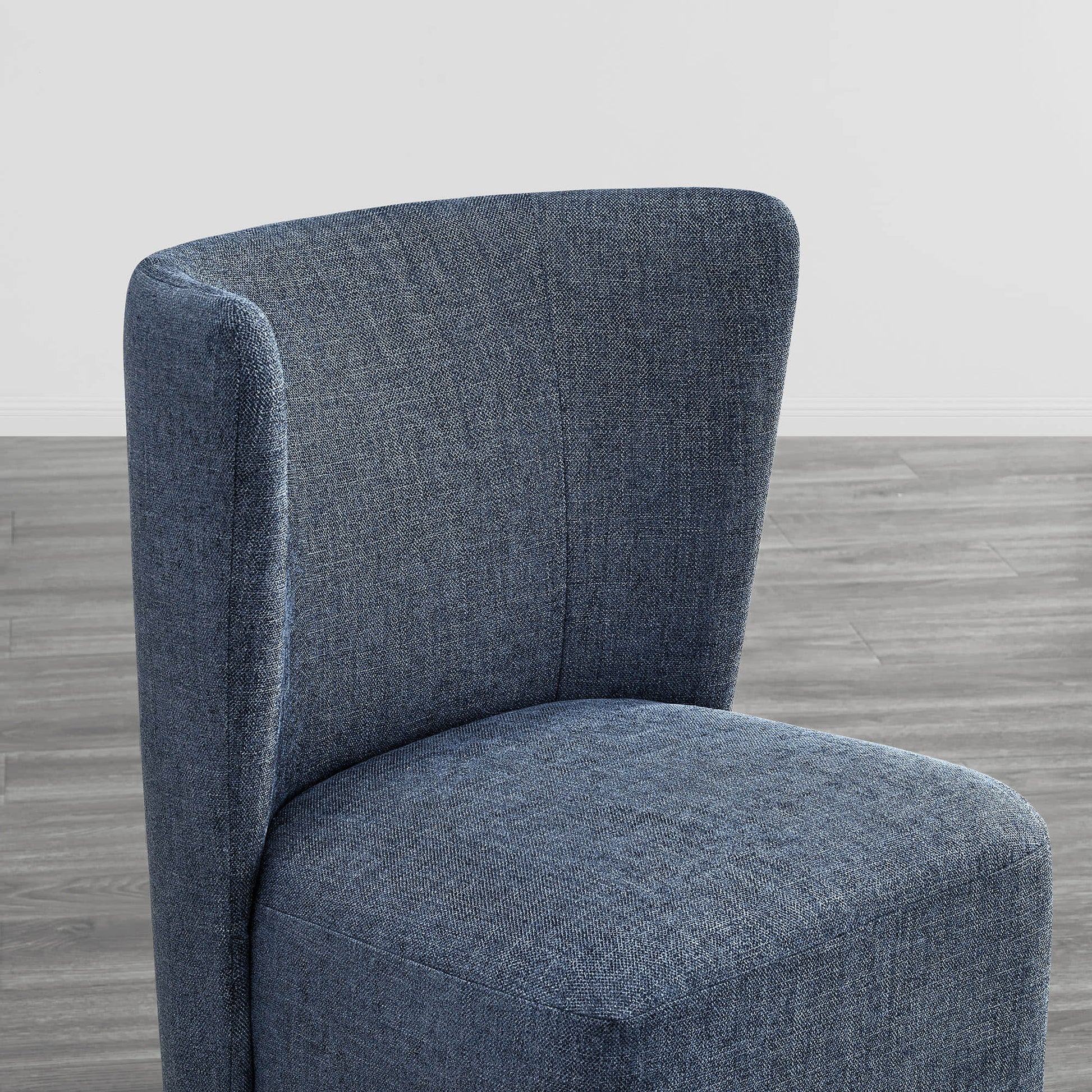 Stylish blue wingback dining chair with a curved back and textured upholstery - CHITA Living