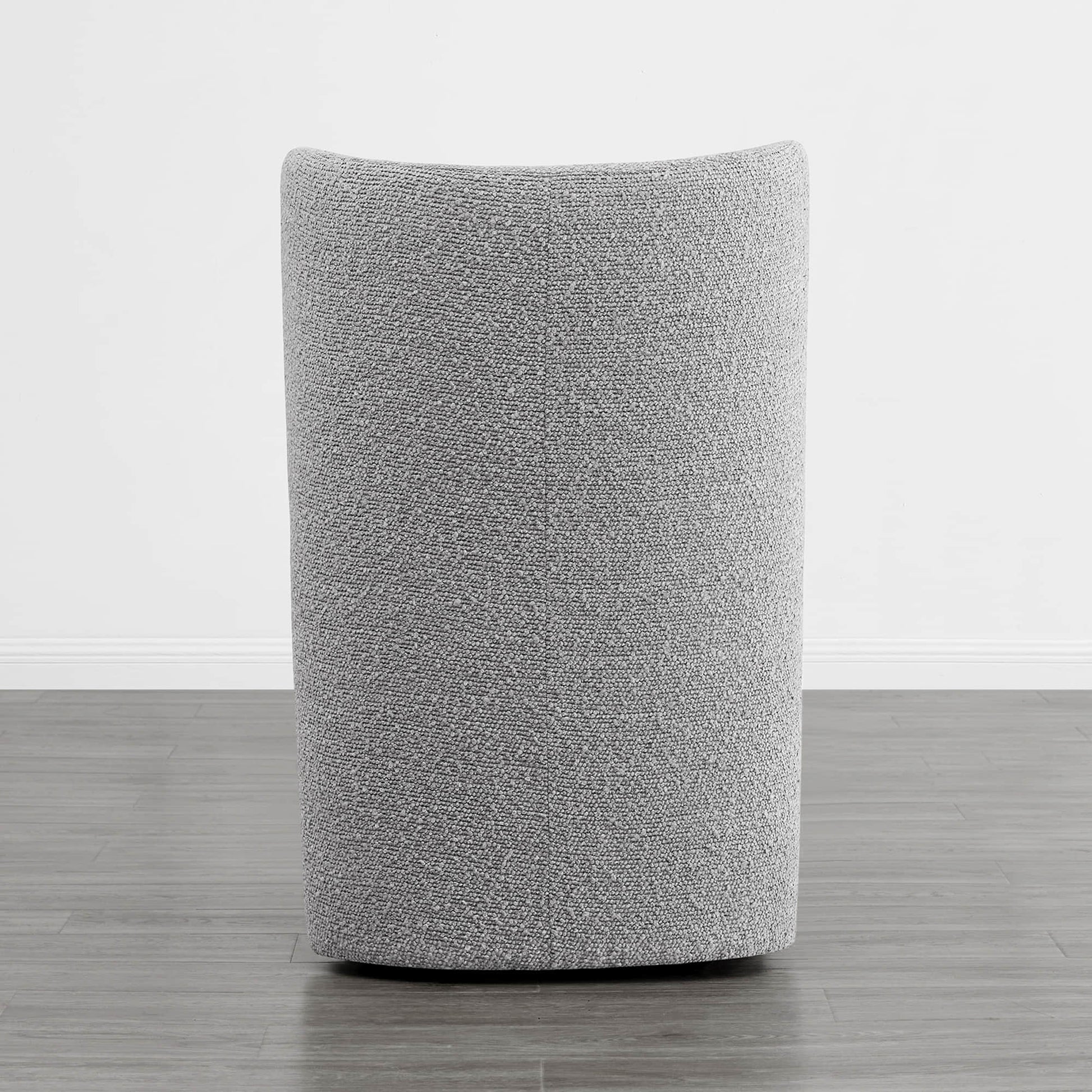 Back view of a soothing gray boucle upholstered wingback chair in a minimalist setting - CHITA Living