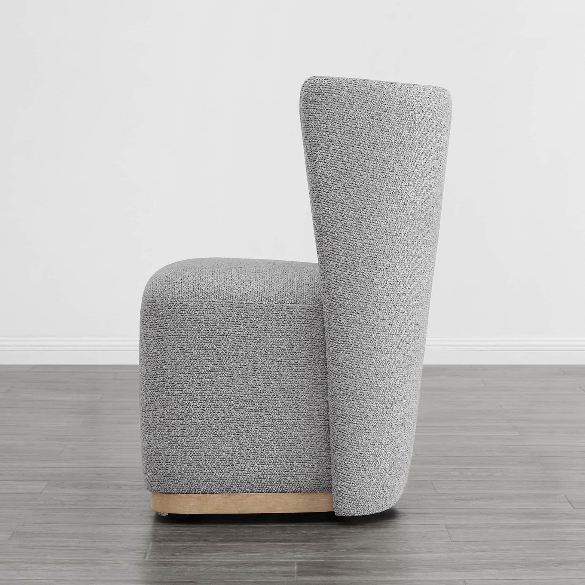 Side view of modern gray wingback dining chair with textured upholstery and curved design - CHITA Living