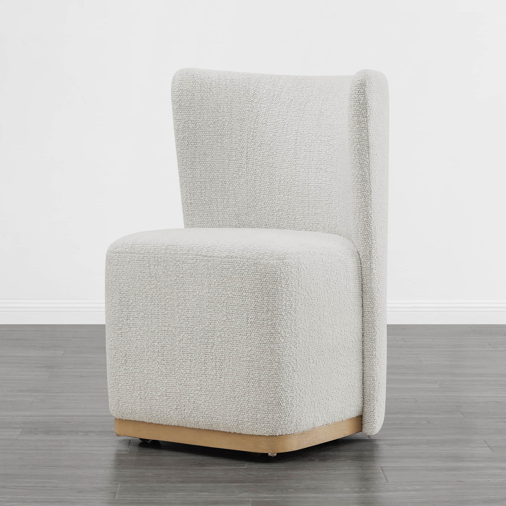 Textured cream wingback chair with modern curved design in minimalist room - CHITA Living