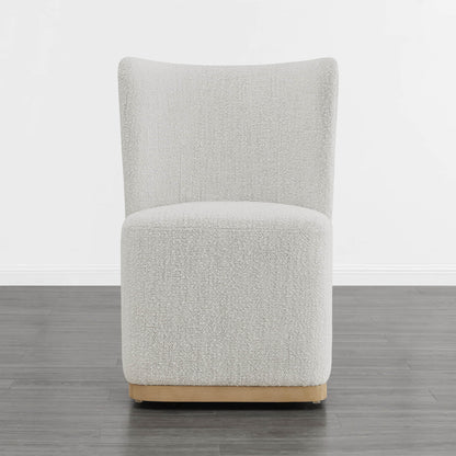 Cream textured wingback dining chair with curved base in modern minimalist room - CHITA Living
