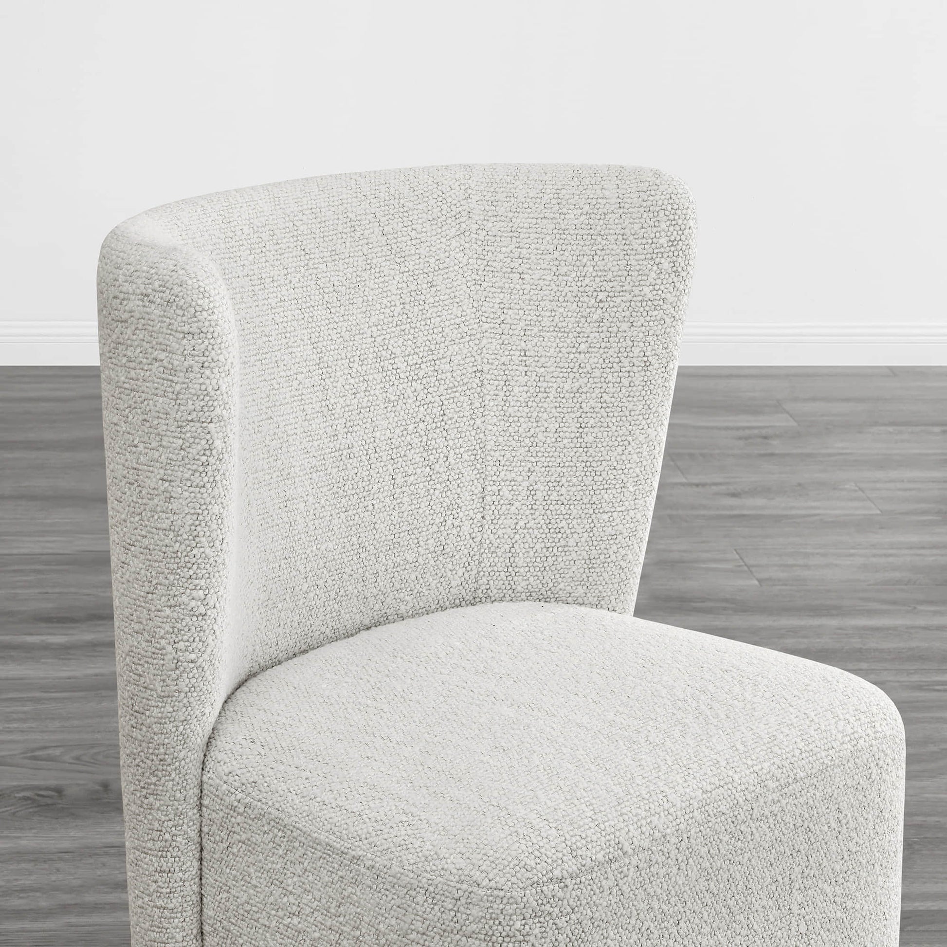 Textured cream wingback dining chair with a stylish curved design in modern interior - CHITA Living