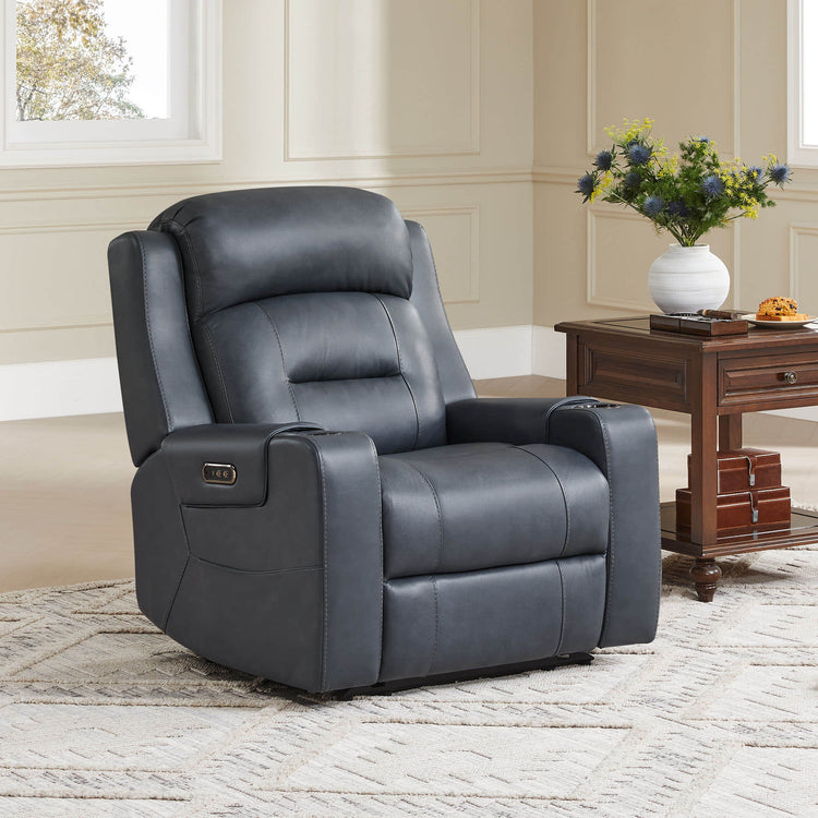 A dark gray leather recliner with a power headrest, next to a wooden side table with a vase of flowers.