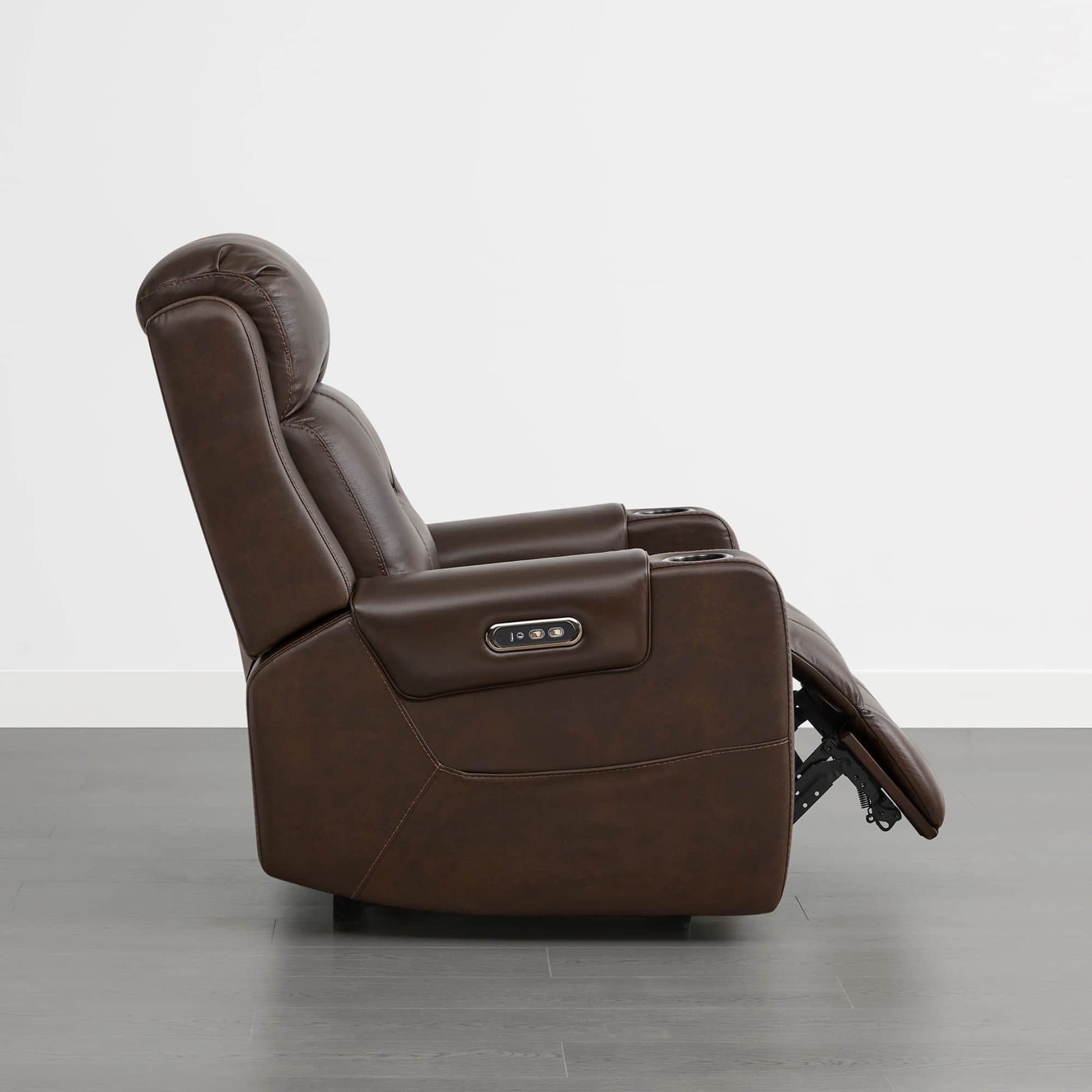 A dark brown leather recliner with a power headrest, cup holders, and control panel on the armrest.