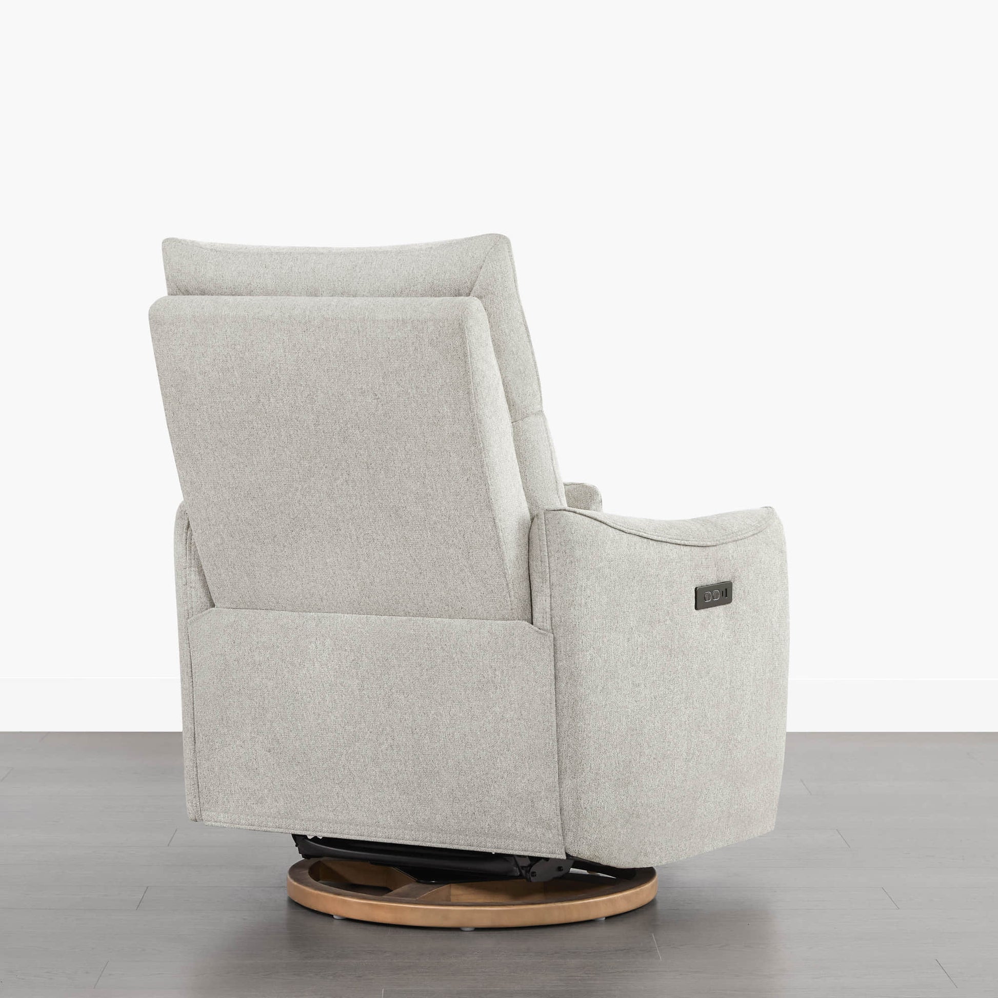 Light grey Janice Power Swivel Nursery Glider Recliner back view, wood base, power headrest, modern nursery furniture.