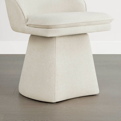 Close-up view of a cream swivel chair featuring a cushioned seat and a modern, tapered base design.