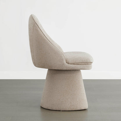 Side view of a modern swivel dining chair with a beige fabric finish.