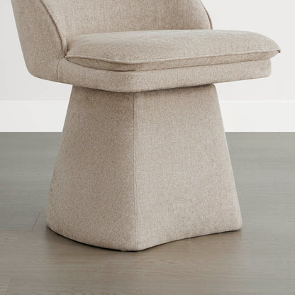 Close-up view of the base and seat of a beige swivel dining chair, showcasing its textured fabric and cushioned seat.
