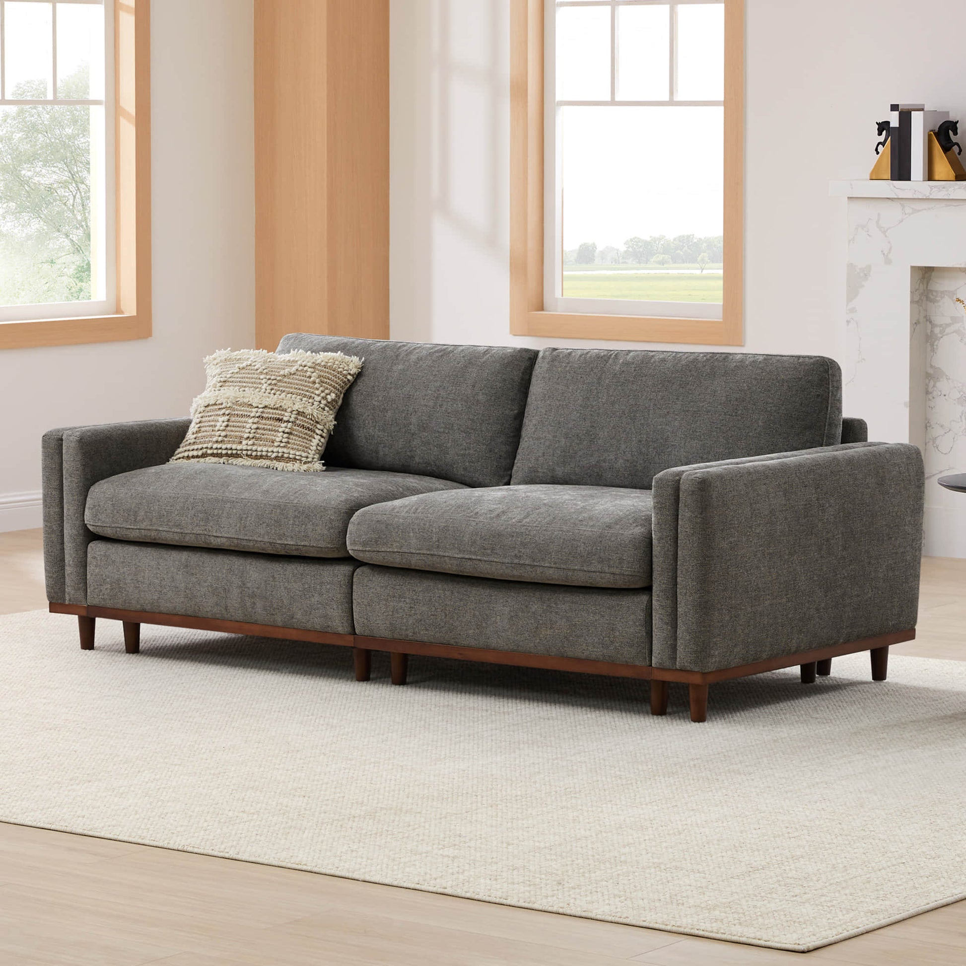Gray modular sectional sofa with plush cushions in a modern living room - CHITA Living