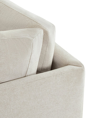 Close-up of beige modular corner seat with plush cushions for modern living spaces - CHITA Living