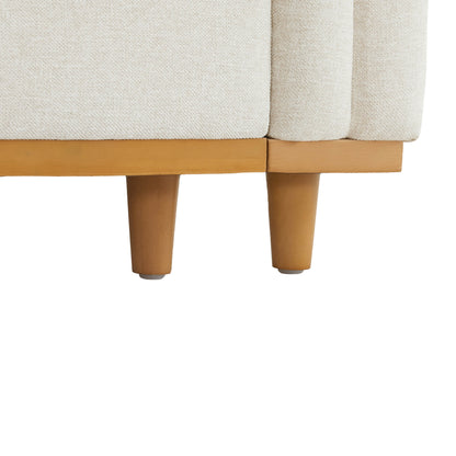 Close-up of Liam Modular Sofa wood base and legs with soft beige fabric - CHITA Living