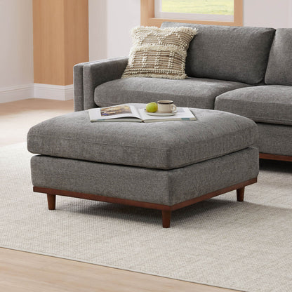 Liam modular ottoman with soft gray fabric and wooden base in modern living space - CHITA Living