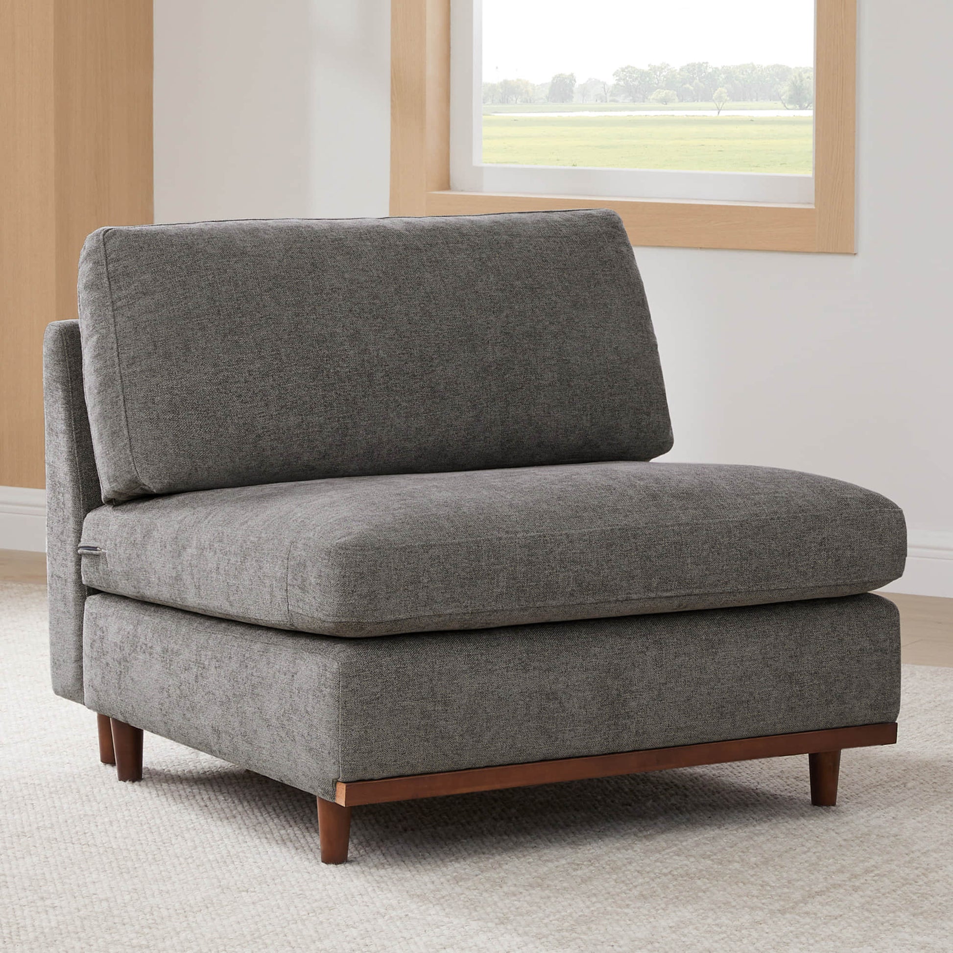Liam modular sofa armless chair in soft gray fabric with wooden base in bright room - CHITA Living
