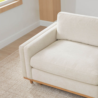 Liam Modular Sofa close-up with beige cushions and wood base in bright room - CHITA Living