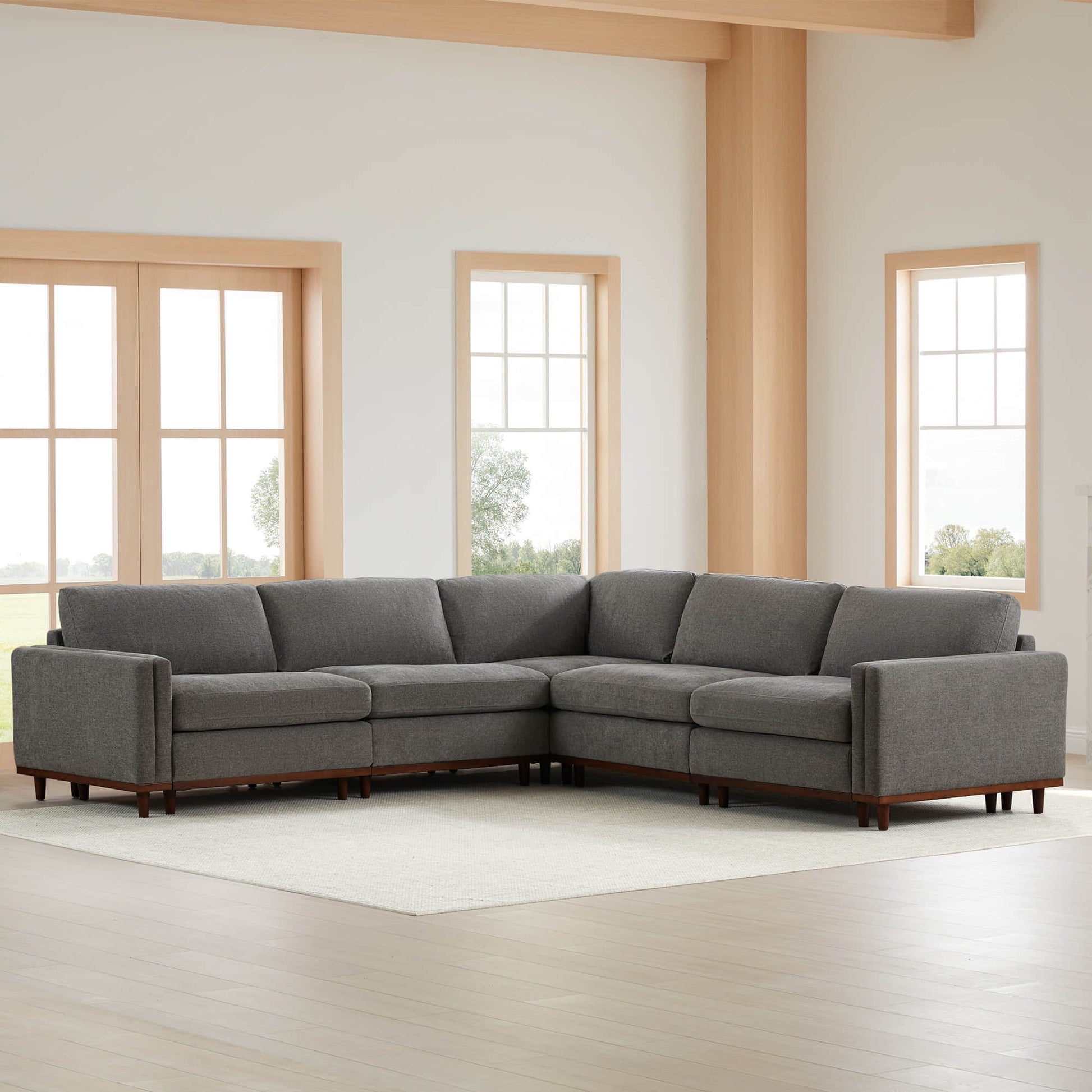 Liam 5-Piece Overstuffed Sectional sofa in gray fabric within a bright, modern living room - CHITA Living