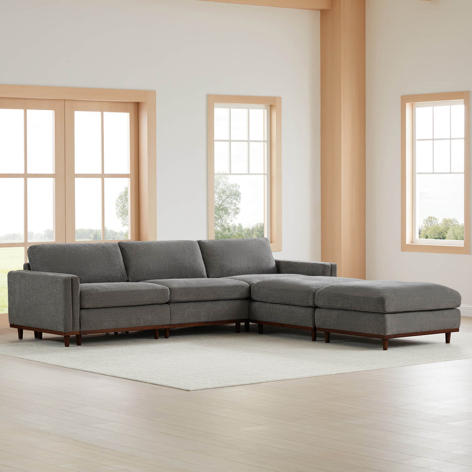 Liam 5-Piece Overstuffed Sectional sofa in a bright living room with large windows - CHITA Living