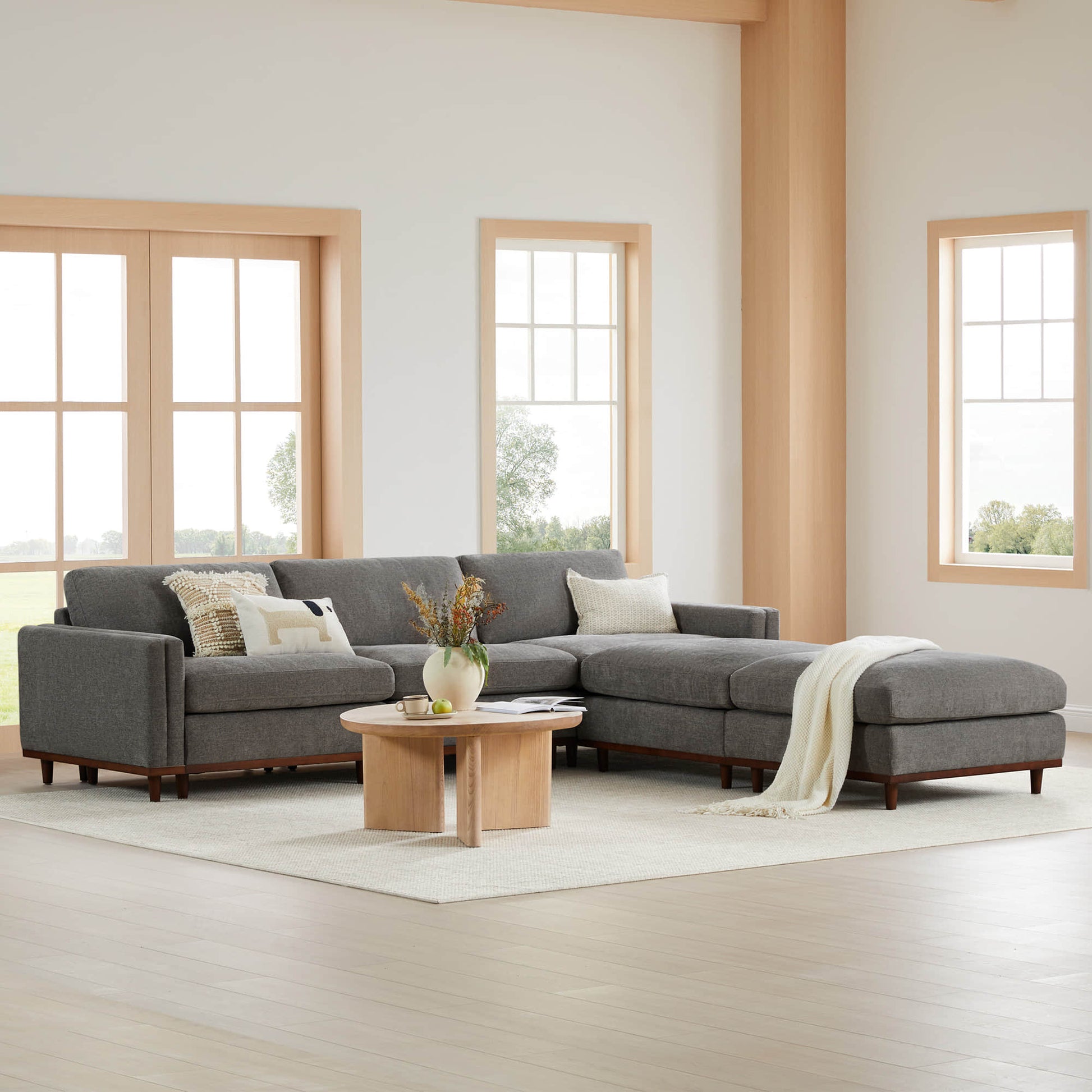 Liam 5-Piece Overstuffed Sectional in a bright, spacious living room with large windows - CHITA Living