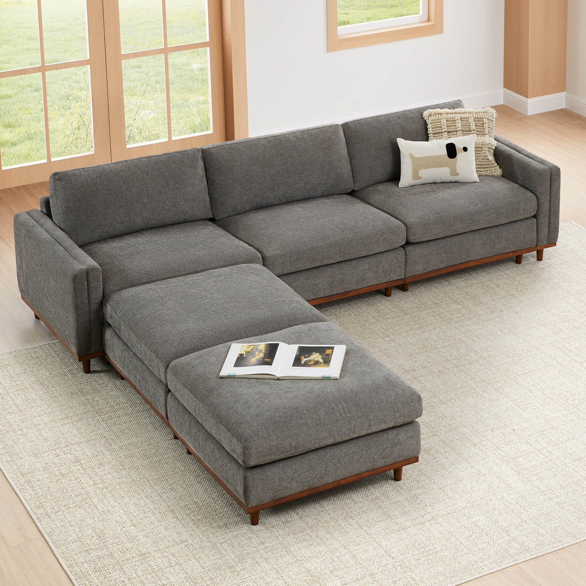Liam 5-Piece Overstuffed Sectional in bright living room with wooden base and a book - CHITA Living