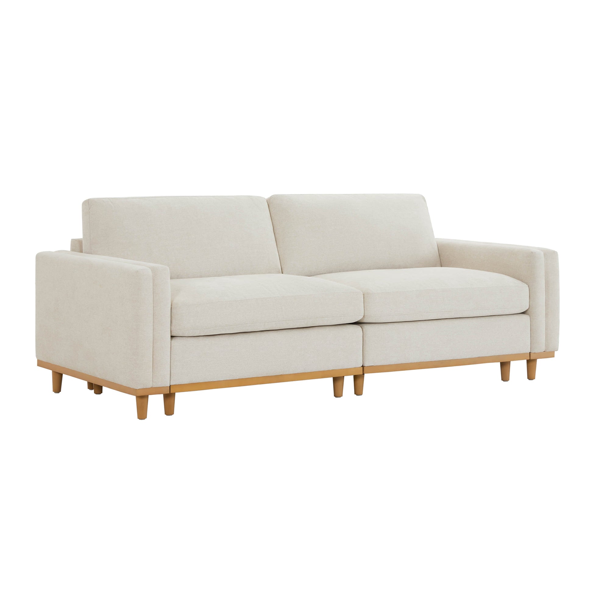 Beige overstuffed 2-piece sectional sofa with wooden legs in a stylish living room - CHITA Living