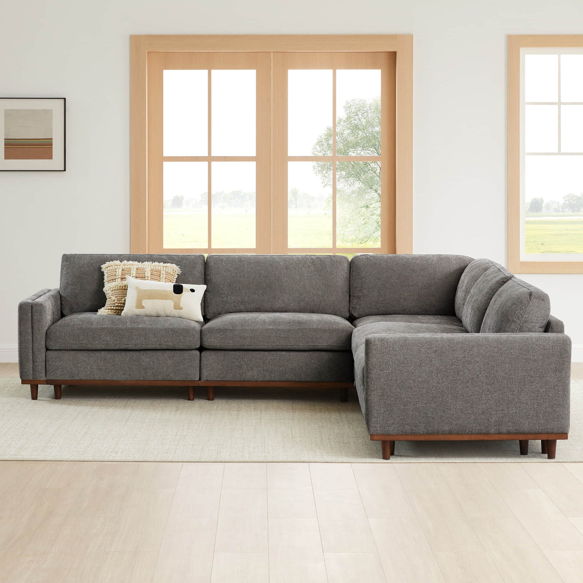 Liam 5-Piece Overstuffed Sectional in gray fabric with wooden base in bright living room - CHITA Living
