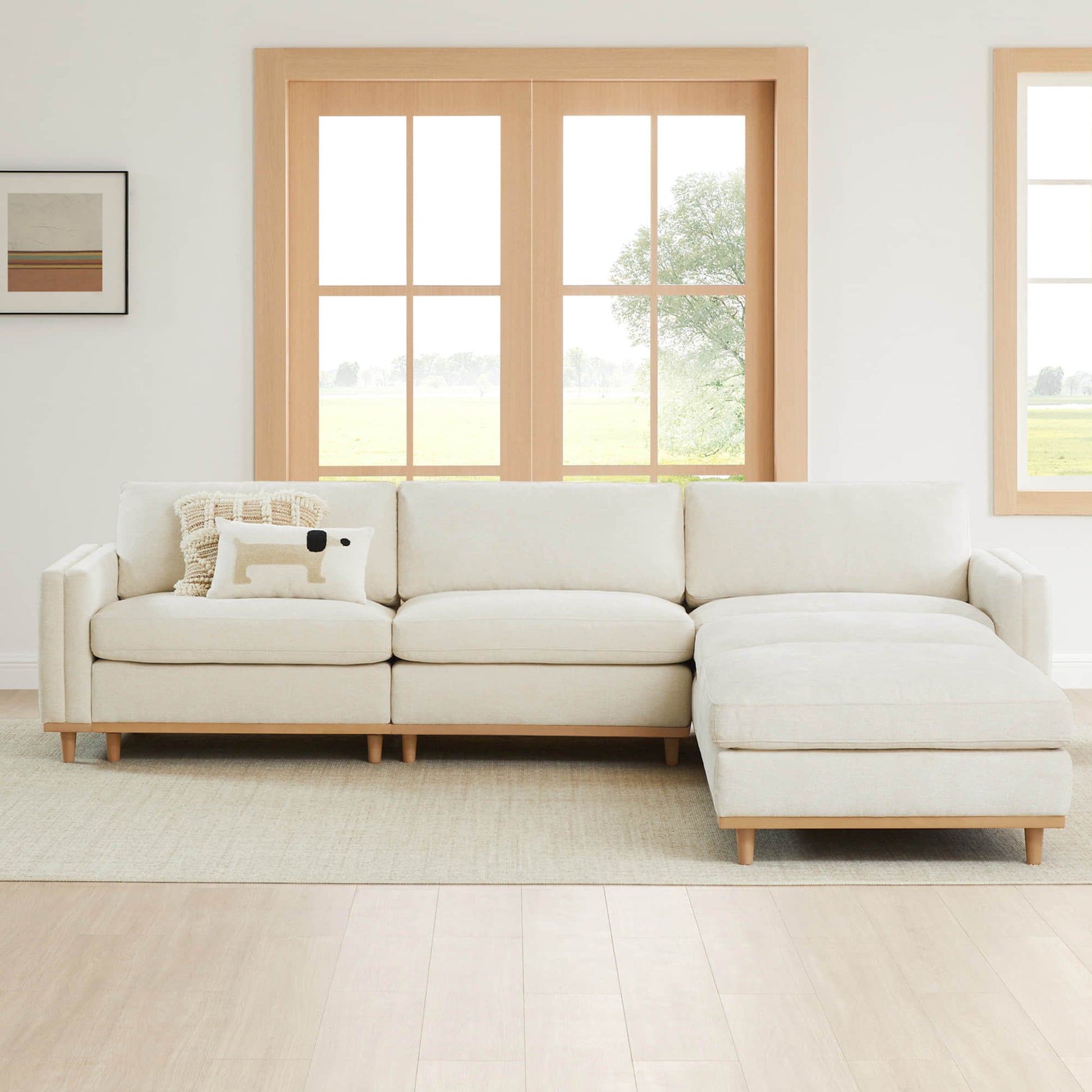 Liam 5-Piece Overstuffed Sectional with light fabric in a spacious modern living room - CHITA Living