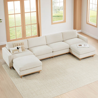 Liam overstuffed modular sectional sofa in a bright, modern living room with large windows - CHITA Living