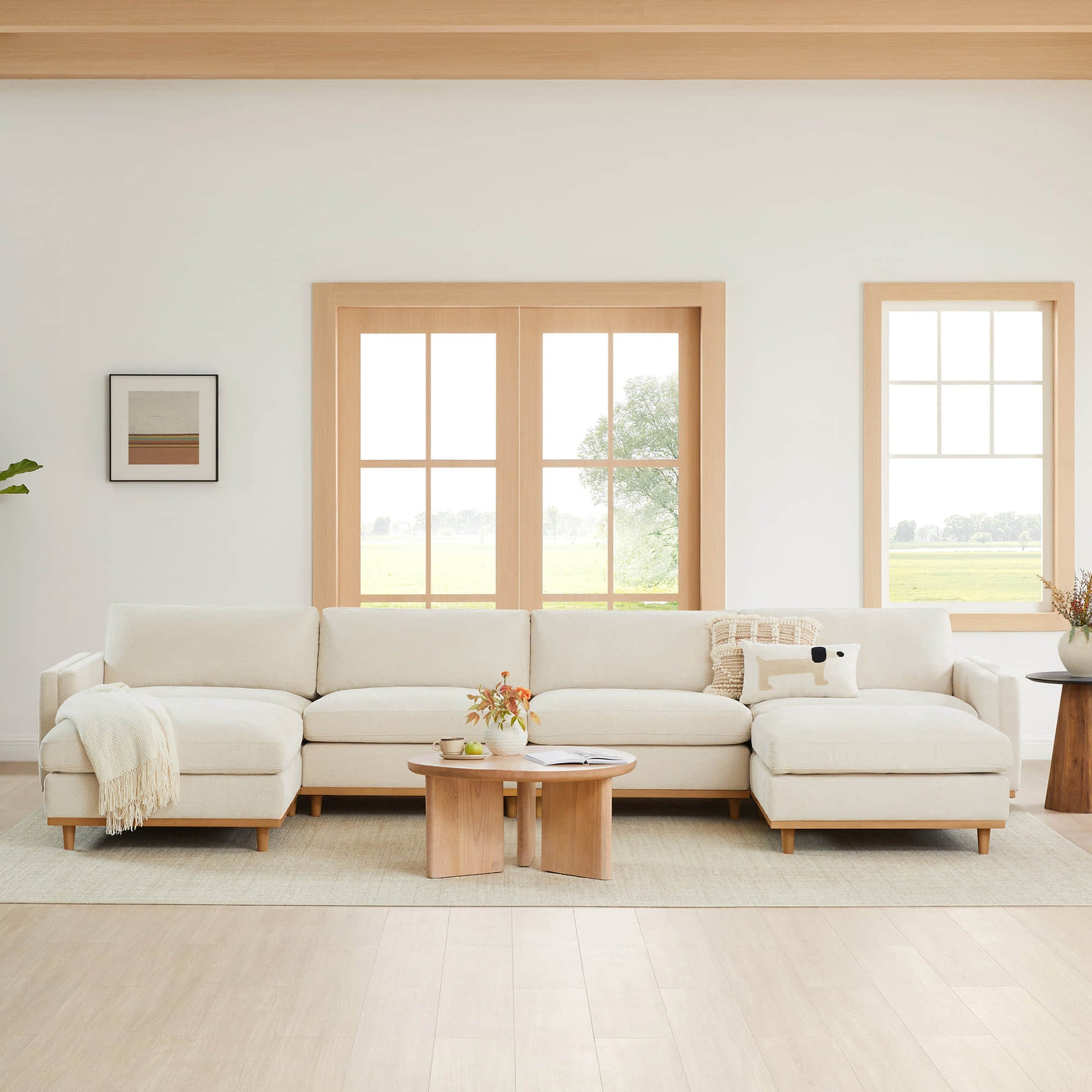 Liam modular sectional sofa in a bright, airy living room with large windows - CHITA Living