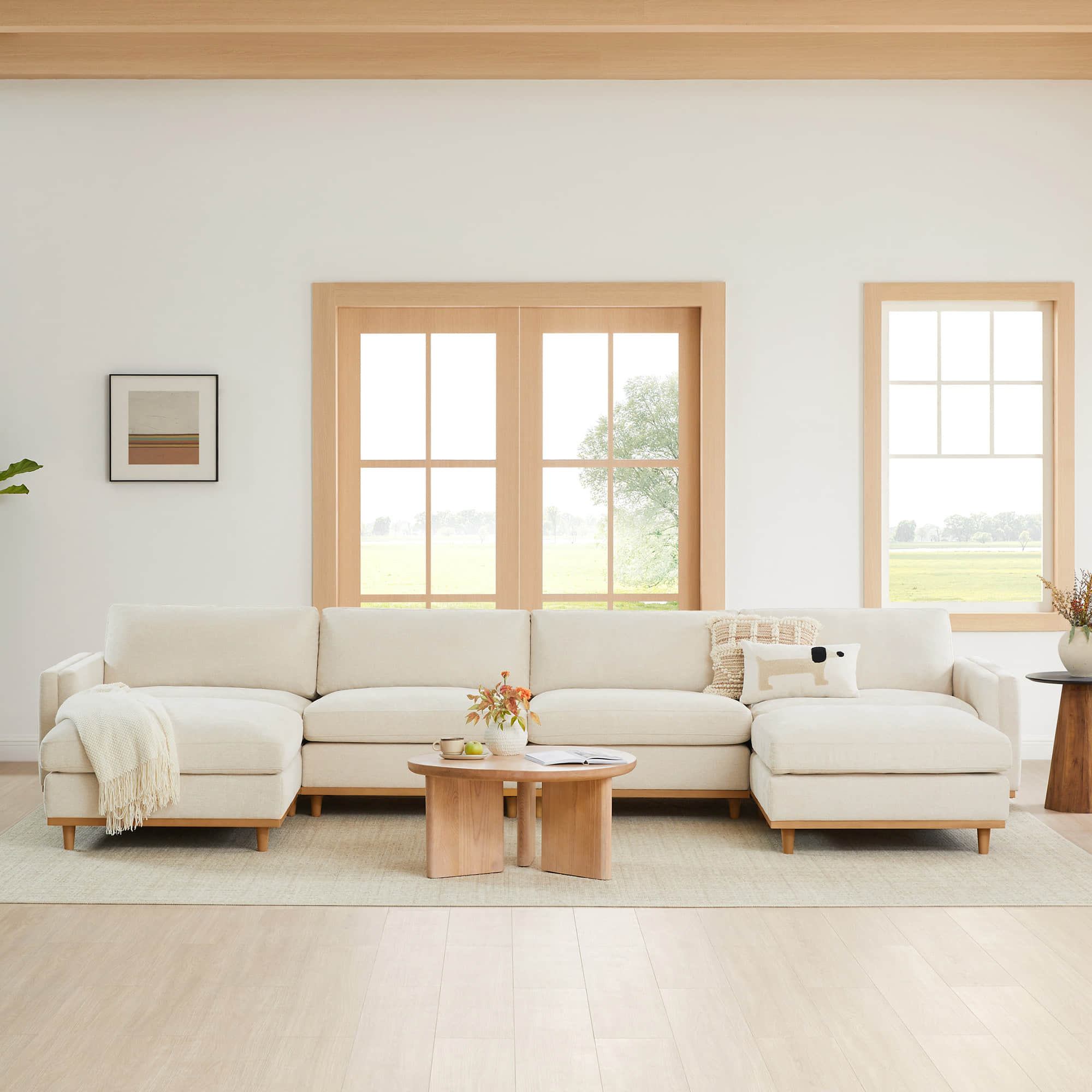 Liam modular sectional sofa in a bright, airy living room with large windows - CHITA Living