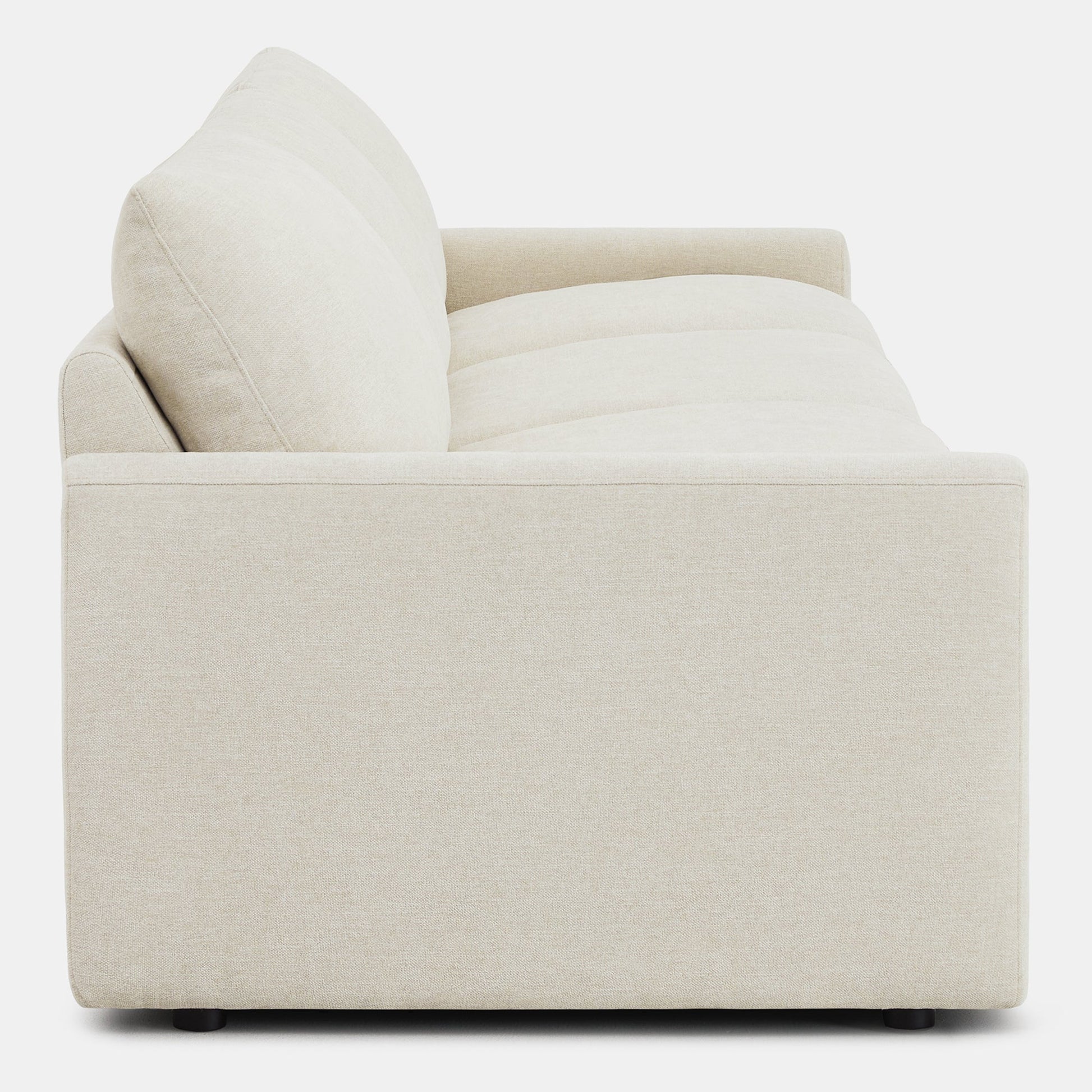 Side view of Ohana 3-Seat Motion Modular Sofa in light beige, emphasizing plush cushions - CHITA Living