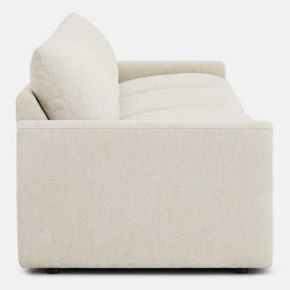 Side view of Ohana 3-Seat Motion Modular Sofa in light beige, emphasizing plush cushions - CHITA Living