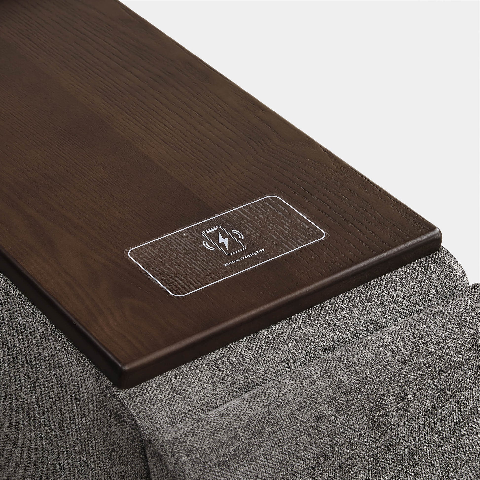 Wooden armrest with wireless charging pad label on Ohana modular sofa - CHITA Living