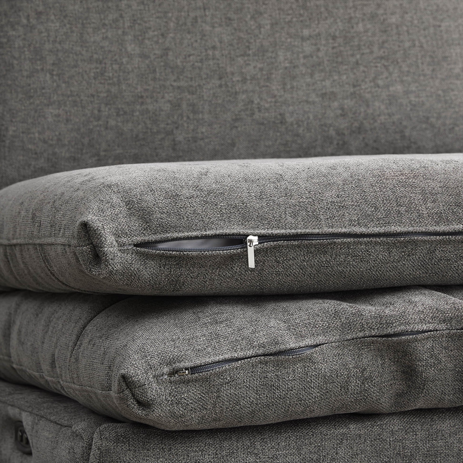 Close-up of zip-off covers on Ohana Modular Sofa cushions in grey fabric - CHITA Living