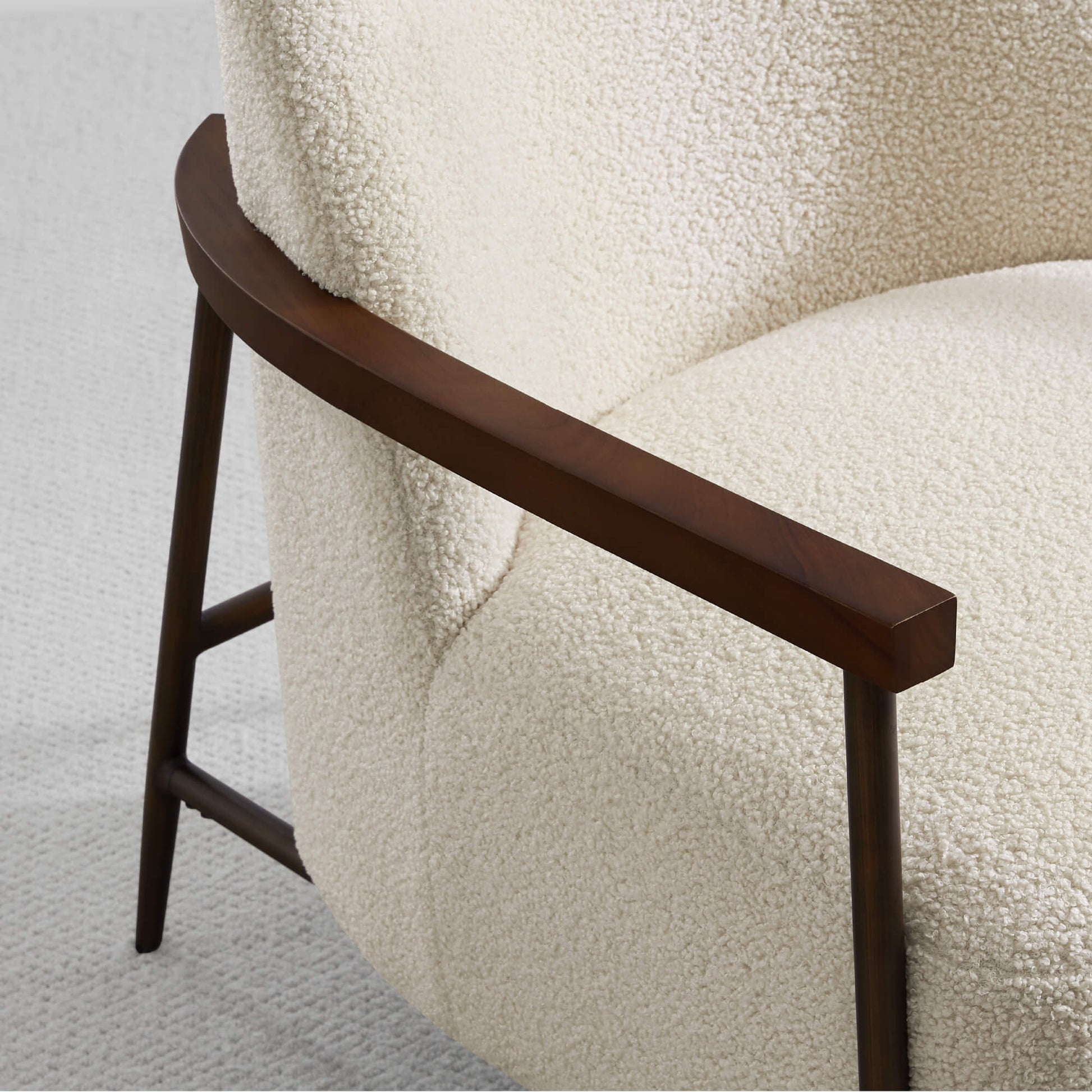 Close-up of Teddi Accent Chair's plush fabric and wood armrest in modern decor - CHITA Living